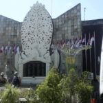 
              Tourists visit at the Bali Bombing Memorial in Kuta, Bali, Indonesia on Friday, Aug. 19, 2022. Australia's leader said Friday that it's upsetting Indonesia has further reduced the prison sentence of the bombmaker in the Bali terror attack that killed 202 people, which could free him within days if he's granted parole. (AP Photo/Firdia Lisnawati)
            