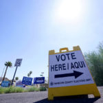 
              A where to vote sign points voters in the direction of the polling station as the sun beats down as Arizona voters go the polls to cast their ballots, Tuesday, Aug. 2, 2022, in Phoenix. (AP Photo/Ross D. Franklin)
            