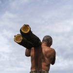 
              A member of the Dnipro-1 regiment carries a log to fortify a position near Sloviansk, Donetsk region, eastern Ukraine, Friday, Aug. 5, 2022. From a position on the outskirts of the city, soldiers with the Dnipro-1 regiment are expanding a network of trenches and digging bunkers capable of protecting soldiers against mortar strikes and phosphorous bombs. (AP Photo/David Goldman)
            