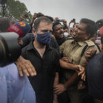 
              Policemen detain Congress party leader Rahul Gandhi during a protest in New Delhi, India, Friday, Aug. 5, 2022. Indian police detained dozens of opposition Congress party lawmakers, including Rahul Gandhi, a party leader, as they tried to march to the president’s palace and prime minister’s residence to protest soaring prices of fuel and foodstuffs, and a rise in goods and services tax. (AP Photo/Altaf Qadri)
            