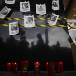 
              Photos of slain journalists are posted up on a wall during a vigil to protest the murder of journalist Fredid Roman, outside Mexico's Attorney General's office in Mexico City, Wednesday, Aug. 24, 2022. Roman was the 15th media worker killed so far this year in Mexico, where it is now considered the most dangerous country for reporters outside a war zone. (AP Photo/Eduardo Verdugo)
            