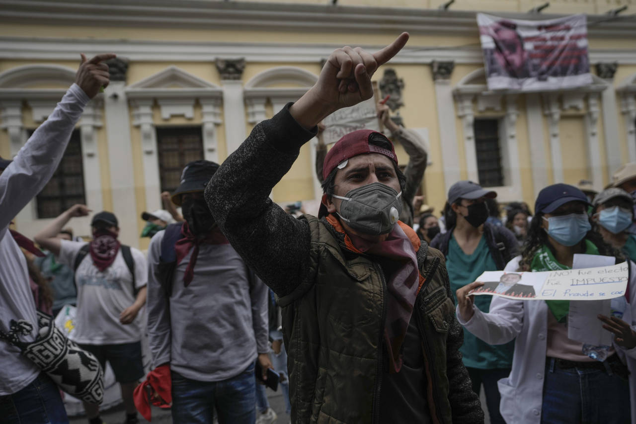 Students and small farmers chant slogans against the government of President Alejandro Giammattei d...
