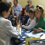 
              People receive iodine-containing tablets at a distribution point in Zaporizhzhia, Ukraine, Friday, Aug. 26, 2022. A mission from the U.N.'s International Atomic Energy Agency is expected to visit the Zaporizhzhia nuclear power plant next week after it was temporarily knocked offline and more shelling was reported in the area overnight, Ukrainian officials said Friday. (AP Photo/Andriy Andriyenko)
            