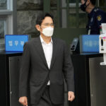 
              FILE - Samsung Electronics Vice Chairman Lee Jae-yong walks out from a detention center in Uiwang, South Korea, Aug. 13, 2021. South Korea's president will pardon billionaire Samsung heir Lee Jae-yong a year after he was released on parole after serving 18 months in prison over his involvement in a massive corruption scandal that triggered waves of protests and toppled a presidency. The decision by President Yoon Suk Yeol was announced by his justice minister on Friday, Aug. 12, 2022. (AP Photo/Lee Jin-man, File)
            