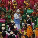 
              Indian Prime Minister Narendra Modi, center, greets artists performing at the 17th-century Mughal-era Red Fort on Independence Day in New Delhi, India, Monday, Aug.15, 2022. The country is marking the 75th anniversary of its independence from British rule. (AP Photo/Pankaj Nangia)
            