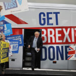 
              FILE - Britain's Prime Minister Boris Johnson addresses his supporters prior to boarding his General Election campaign trail bus in Manchester, England, Friday, Nov. 15, 2019. The moving vans have already started arriving in Downing Street, as Britain's Conservative Party prepares to evict Johnson. Debate about what mark he will leave on his party, his country and the world will linger long after he departs in September. (AP Photo/Frank Augstein, Pool, File)
            