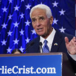 
              Democratic gubernatorial candidate Rep Charlie Crist, D-Fla., gestures as he speaks to supporters after declaring victory Tuesday, Aug. 23, 2022, in St. Petersburg, Fla. Crist defeated Agriculture Commissioner Nikki Fried in the primary and will face incumbent Republican Gov. Ron DeSantis in November. (AP Photo/Chris O'Meara)
            