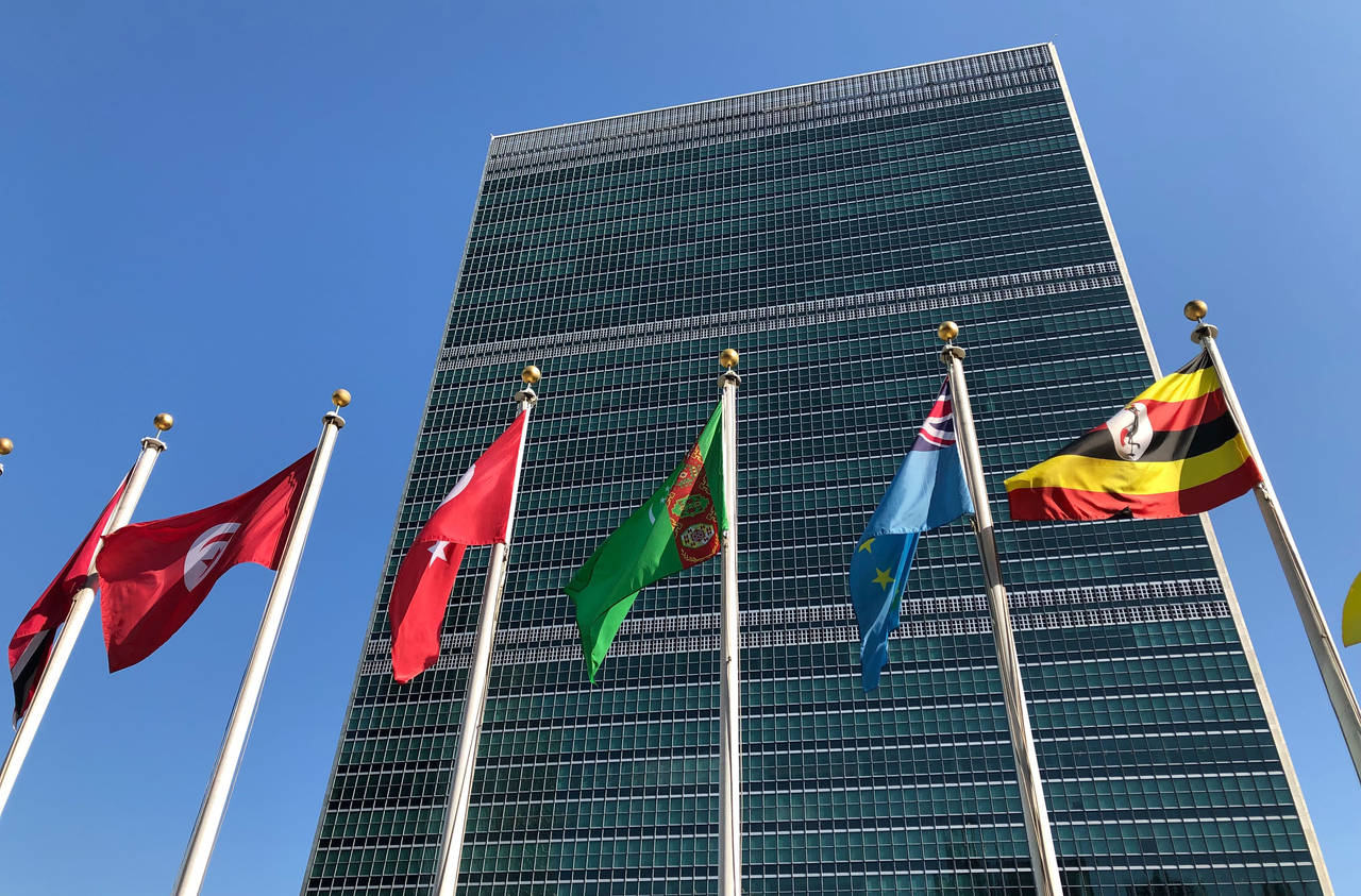 FILE - Flags fly outside the United Nations headquarters during the 74th session of the United Nati...