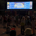 
              Tennis fans watch play between Serena Williams, of the United States, and Danka Kovinic, of Montenegro, during the first round of the US Open tennis championships, Monday, Aug. 29, 2022, in New York. (AP Photo/Julia Nikhinson)
            