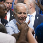
              President Joe Biden greets supporters during a rally for the Democratic National Committee at Richard Montgomery High School, Thursday, Aug. 25, 2022, in Rockville, Md. (AP Photo/Alex Brandon)
            
