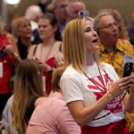 
              Supporters of republican Arizona Gubernatorial candidate Karrin Taylor Robson watch polling results at a campaign party, Tuesday, Aug. 2, 2022, in Phoenix. (AP Photo/Matt York)
            