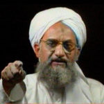 
              FILE - In this file image from television transmitted by the Arab news channel Al-Jazeera on Jan. 30, 2006, al-Qaida's then deputy leader Ayman al-Zawahri gestures while addressing the camera. Al-Zawahri, the top al-Qaida leader, was killed by the U.S. over the weekend in Afghanistan. President Joe Biden is scheduled to speak about the operation on Monday night, Aug. 1, 2022, from the White House in Washington. (AP Photo/Al-Jazeera, File)
            