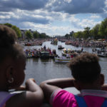 
              Hundreds of thousands of people lined canals in the Dutch capital to watch the colorful spectacle of the Pride Canal Parade return for the 25th edition after the last two events were canceled due to the COVID-19 pandemic, in Amsterdam, Netherlands, Saturday, Aug. 6, 2022. (AP Photo/Peter Dejong)
            