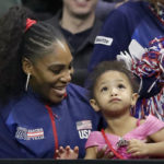 
              FILE - United States' Serena Williams sits with her daughter, Alexis Olympia Ohanian Jr., as they look on during a Fed Cup qualifying tennis match Saturday, Feb. 8, 2020, in Everett, Wash. After nearly three decades in the public eye, few can match Serena Williams' array of accomplishments, medals and awards. Through it all, the 23-time Grand Slam title winner hasn't let the public forget that she's a Black American woman who embraces her responsibility as a beacon for her people. (AP Photo/Elaine Thompson, File)
            
