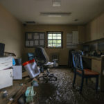 
              Mud covers the floor of the front office at the MCHC Isom Medical Clinic in Isom, Ky., on Monday, Aug. 1, 2022. Flooding devastated many counties in Eastern Kentucky last week. (Ryan C. Hermens/Lexington Herald-Leader via AP)
            