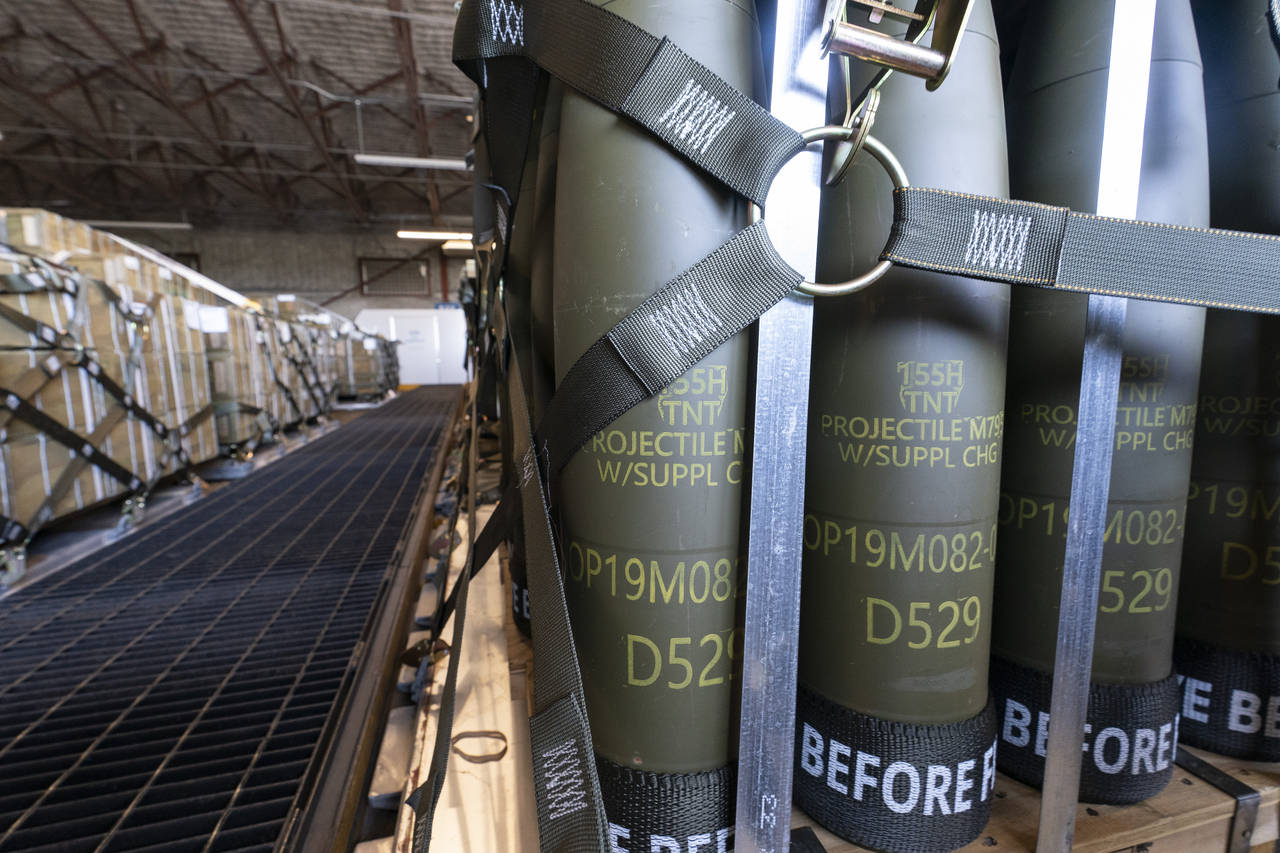 FILE - Pallets of 155 mm shells ultimately bound for Ukraine are loaded by the 436th Aerial Port Sq...