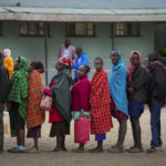 
              People line up to vote at the Oltepesi Primary School, Kajiado County in Nairobi, Kenya, Tuesday Aug. 9, 2022. Kenyans are voting to choose between opposition leader Raila Odinga and Deputy President William Ruto to succeed President Uhuru Kenyatta after a decade in power. (AP Photo/Ben Curtis)
            