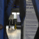 
              The gates at Northfields tube station are closed as members of the Rail, Maritime and Transport union (RMT) strike over jobs, pay and pensions in London, Friday, Aug. 19, 2022. A strike by London Underground workers brought the British capital’s transit network to a grinding halt on Friday, a day after a nationwide walkout by railway staff. (AP Photo/Frank Augstein)
            