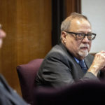 
              FILE - Greg McMichael looks at the gallery during the testimony of his son, Travis McMichael, in the trial of himself, his son and William "Roddie" Bryan in the Glynn County Courthouse on Nov. 16, 2021, in Brunswick, Ga. Months after they were sentenced to life in prison for murder, the three white men who chased and killed Ahmaud Arbery in a Georgia neighborhood faced a second round of criminal penalties Monday, Aug. 8, 2022, for federal hate crimes committed in the deadly pursuit of the 25-year-old Black man. (AP Photo/Stephen B. Morton, Pool, File)
            