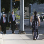 
              Joseph Magliolo, far left, and Andino Reynal, lawyers representing Alex Jones, arrive at the Travis County Courthouse in Austin, Texas, Monday, Aug. 1, 2022. Alex Jones has been found to have defamed the parents of a Sandy Hook student for calling the attack a hoax. (Briana Sanchez/Austin American-Statesman via AP)
            