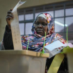 
              A woman casts her ballot at the Kibera primary school in Nairobi, Kenya, Tuesday Aug. 9, 2022. Kenyans are voting to choose between opposition leader Raila Odinga and Deputy President William Ruto to succeed President Uhuru Kenyatta after a decade in power. (AP Photo/Mosa'ab Elshamy)
            
