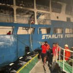 
              In this handout photo provided by the Philippine Coast Guard, Coast guard personnel help in controlling the fire of M/V Asia Philippines, an inter-island cargo and passenger vessel, they were riding caught fire while it was approaching Batangas port, southern Philippines on Friday. Aug. 26, 2022. Philippine coast guard personnel and volunteers have rescued more than 80 passengers and crew of an inter-island ferry that caught fire as it approached a port south of Manila, prompting many to jump into the water as flames spread fast in windy weather, officials said Saturday. (Philippine Coast Guard via AP)
            