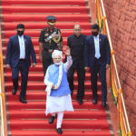 
              Indian Prime Minister Narendra Modi, waves as he returns after addressing the nation at the 17th-century Mughal-era Red Fort on Independence Day in New Delhi, India, Monday, Aug.15, 2022. The country is marking the 75th anniversary of its independence from British rule. (AP Photo/Pankaj Nangia)
            