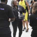 
              Martha Reeves of Martha and the Vandellas dances to Motown music playing at the Motown Museum. The museum celebrates the completion of two of three phases of an ambitious expansion plan, including a new courtyard in front of the museum, during a gathering in Detroit, Monday, August 8, 2022. (Daniel Mears/Detroit News via AP)
            