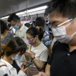 
              Commuters ride on a subway train during the morning rush hour in the central business district in Beijing, Tuesday, Aug. 9, 2022. China's 11 million university graduates are struggling in a bleak job market this summer as repeated shutdowns under China's anti-COVID lockdowns forced companies to retrench and driven many restaurants and other small employers out of business. (AP Photo/Mark Schiefelbein)
            