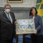 
              In this photo released by the Taiwan Presidential Office, St. Vincent and the Grenadines' Prime Minister Ralph Gonsalves, left, exchanges gifts with Taiwan's President Tsai Ing-wen during a visit to the Presidential Office in Taipei, Taiwan on Monday, Aug. 8, 2022. The prime minister of St. Vincent and the Grenadines said Monday that his country and Taiwan's relations are grounded in everlasting principles during his twelfth visit to the island. (Taiwan Presidential Office via AP)
            