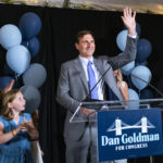 
              Attorney Dan Goldman stands with members of his family and supporters during an address on the evening of the Democratic primary election Tuesday, Aug. 23, 2022, in New York. Goldman is running in the packed Democratic primary race for New York's 10th Congressional District. (AP Photo/Craig Ruttle)
            