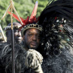 
              King Misuzulu ka Zwelithini  looks on, during a coronation event, at KwaKhangelamankengane Royal Palace in Nongoma, South Africa. Saturday, Aug. 20, 2022. South Africa’s ethnic Zulu nation hosted a coronation event for its new traditional king amid internal divisions that have threatened to tear the royal family apart. King Misuzulu ka Zwelithini, a son of the late King Goodwill Zwelithini who died from a diabetes-related illness in March last year, will undergo the traditional ritual known as ukungena esibayeni (entering the royal village) to mark his installation as the new leader of the Zulu nation. (AP Photo)
            