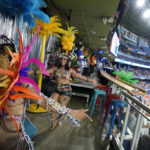 
              Carnival dancers perform during a break at a baseball game at Rogers Center in Toronto, Canada, Wednesday, July 27, 2022. The 55th annual parade returned to the streets after the COVID-19 pandemic cancelled it for two years in a row. (AP Photo/Kamran Jebreili)
            