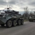
              FILE - A Russian military convoy moves on a highway in an area controlled by Russian-backed separatist forces near Mariupol, Ukraine, on April 16, 2022. As the war in Ukraine stretches into its seventh month, North Korea is hinting at its interest in sending construction workers to help rebuild Russian-occupied territories in the country's east.(AP Photo/Alexei Alexandrov, File)
            