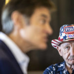 
              Republican nominee for U.S. Senate, Dr. Mehmet Oz, center, drops by The Capitol Diner, Friday, Aug. 12, 2022, in Swatara Township, Pa.  (Sean Simmers/The Patriot-News via AP)
            