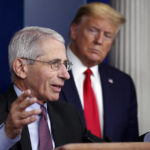 
              FILE - President Donald Trump watches as Dr. Anthony Fauci, director of the National Institute of Allergy and Infectious Diseases, speaks about the coronavirus in the James Brady Press Briefing Room of the White House, April 22, 2020, in Washington. Fauci, the nation's top infectious disease expert who became a household name, and the subject of partisan attacks, during the COVID-19 pandemic, announced Monday he will depart the federal government in December after more than 5 decades of service.  (AP Photo/Alex Brandon, File)
            