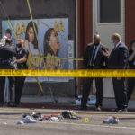
              FILE - A photographer with the Los Angeles Police Department, far right, documents the remains of a crime scene in Beverly Hills, Calif., Friday, June 25, 2021. Homicides in California rose again last year, as did other violent crime, amid rising frustration as the state's top Democrats are seeking to keep their jobs in upcoming elections. (AP Photo/Damian Dovarganes, File)
            