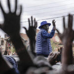 
              Presidential candidate Raila Odinga waves to his supporters after casting his vote at the Kibera Primary School in Nairobi, Kenya, Tuesday, Aug. 9, 2022. Kenyans are voting to choose between opposition leader Raila Odinga and Deputy President William Ruto to succeed President Uhuru Kenyatta after a decade in power. (AP Photo/Mosa'ab Elshamy)
            