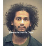
              FILE - In this photo provided by the Alexandria Sheriff's Office is El Shafee Elsheikh who is in custody at the Alexandria Adult Detention Center, Wednesday, Oct. 7, 2020, in Alexandria, Va.  The British national was sentenced to life in prison on Friday, Aug. 19, 2022 for his role in an Islamic State hostage-taking scheme. Roughly two dozen Westerners were taken captive a decade ago by a notorious group of masked captors nicknamed “The Beatles” for their British accents. El Shafee Elsheikh received his sentence Friday in an Alexandria, Va. courtroom. (Alexandria Sheriff's Office via AP)
            