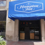
              The Hampton Inn photographed, Monday, Aug. 29, 2022, in Indianapolis. Three members of the Dutch Commando Corps, who were training at a center, were shot outside of the hotel in downtown Indianapolis early Saturday morning. The Dutch Defense Ministry says that one has died. (AP Photo/Darron Cummings)
            