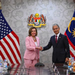 
              This handout photo taken and released by Malaysia’s Department of Information, U.S. House Speaker Nancy Pelosi, left, meets with Malaysia Parliament speaker Azhar Azizan Harun at the parliament house in Kuala Lumpur, Tuesday, Aug. 2, 2022. Pelosi arrived in Malaysia on Tuesday for the second leg of an Asian tour that has been clouded by an expected stop in Taiwan, which would escalate tensions with Beijing. (Malaysia’s Department of Information via AP)
            