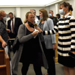 
              Upset family members get comforted by court personnel after Volodymyr Zhukovskyy of West Springfield, Mass., was found not guilty on all charges after the verdicts were read at Coos County Superior Court in Lancaster, N.H., Tuesday, Aug. 9, 2022. The commercial truck driver was charged with negligent homicide in the deaths of seven motorcycle club members in a 2019 crash in Randolph. (David Lane/The Union Leader, Pool via AP)
            