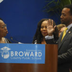 
              New Broward County School Board member Torry Alston, right, is sworn in by former Deputy Superintendent and former Blanche Ely High School Principal Erlean Similey at school district headquarters in Fort Lauderdale, Fla., Tuesday, Aug. 30, 2022. A grand jury report led to the suspension of four of the board members by Gov. Ron DeSantis who appointed the replacements.  (Joe Cavaretta
            