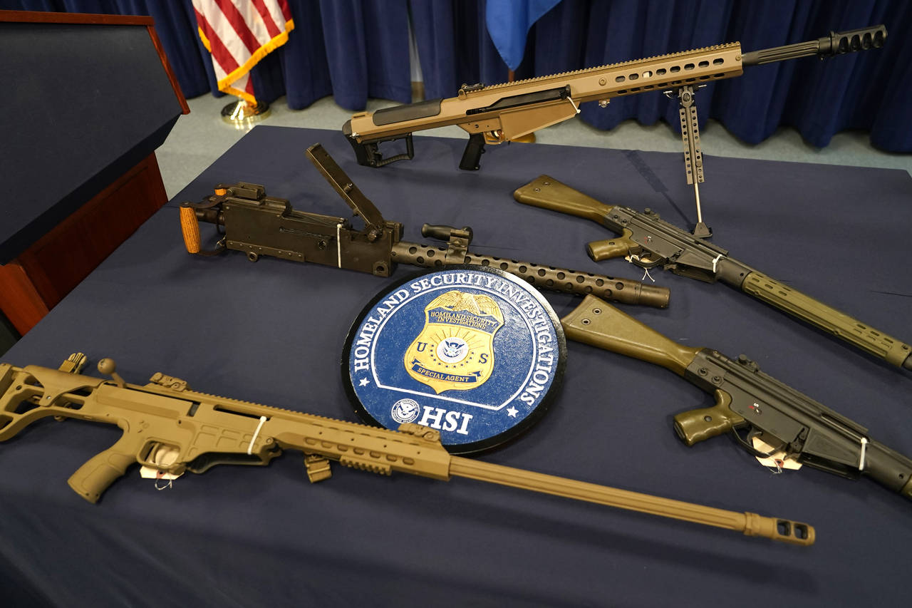 Firearms are displayed during a news conference at the Homeland Security Investigations Miami Field...