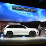 
              Jim Morrison, Head of Jeep Brand North America, introduces the audience to the Jeep Grand Cherokee 4XE 30th Anniversary Edition at the North American International Auto Show, Wednesday, Sept. 14, 2022, in Detroit. (AP Photo/Jose Juarez)
            