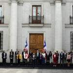 
              Chile's President Gabriel Boric, center, speaks during a ceremony introducing new cabinet members, at La Moneda presidential palace in Santiago, Chile, Tuesday, Sept. 6, 2022. Boric shook up his cabinet Tuesday in what marked a virtual effort to relaunch his government less than 48 hours after citizens overwhelmingly rejected a new progressive constitution he had championed. (AP Photo/Luis Hidalgo)
            