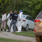 
              Investigators gather in front of a crime scene in Weldon, Saskatchewan, on Sunday, Sept. 4, 2022. Saskatchewan RCMP has confirmed that there are 10 dead while 15 are injured following the stabbings that occurred at James Smith Cree Nation and Weldon in Saskatchewan. (Heywood Yu/The Canadian Press via AP)
            