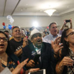 
              Supporters cheer as Rhode Island Gov. Dan McKee gives an acceptance speech at a primary election night watch party in Providence, R.I., Tuesday, Sept. 13, 2022. (AP Photo/David Goldman)
            