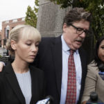 
              Sherri Papini arrives at the federal courthouse for sentencing accompanied by her attorney, William Portanova, right, in Sacramento, Calif., Monday, Sept. 19, 2022. Federal prosecutors are asking that she be sentenced to eight months in prison for faking her own kidnapping in 2016. (AP Photo/Rich Pedroncelli)
            