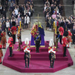 
              Members of the public file past as King Charles III, the Princess Royal, the Duke of York and the Earl of Wessex hold a vigil beside the coffin of their mother, Queen Elizabeth II, as it lies in state on the catafalque in Westminster Hall, at the Palace of Westminster, London, Friday Sept. 16, 2022. (Yui Mok/Pool Photo via AP)
            